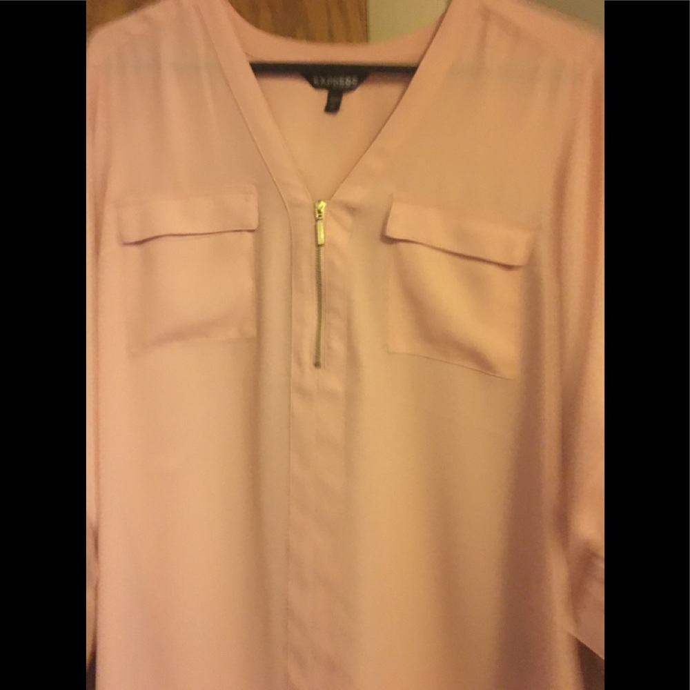 Express top in a peach color front zip and 2 pockets